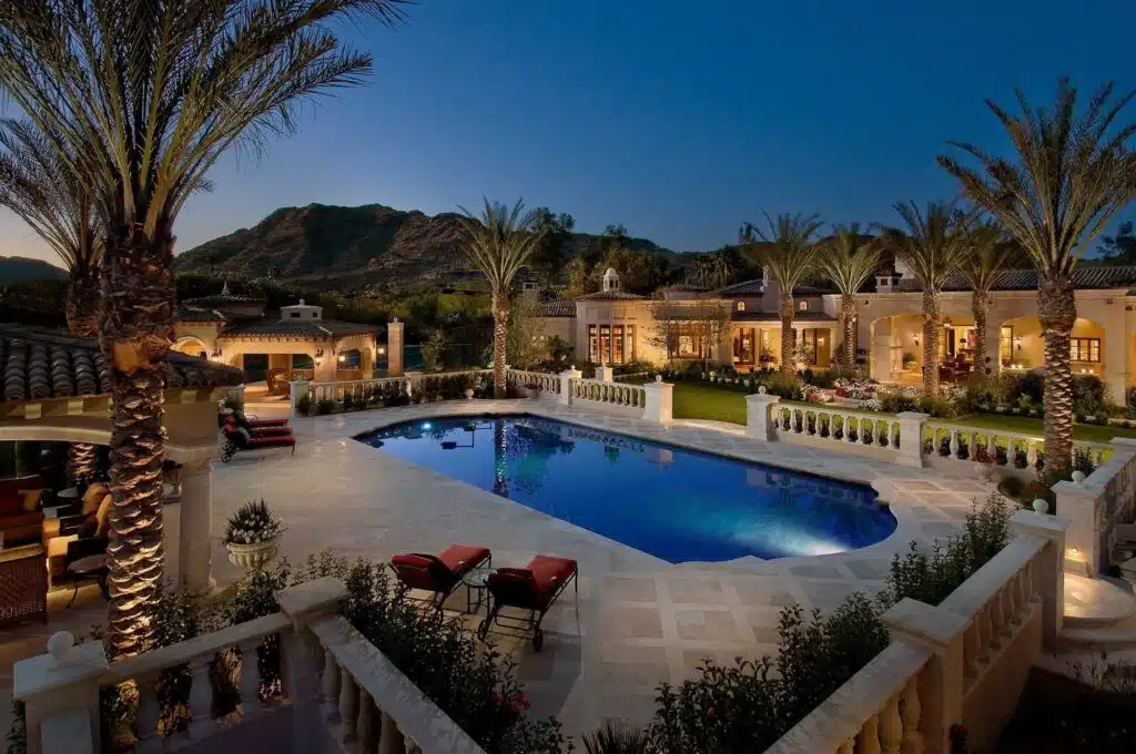 A shaded outdoor living room by Desert Star Construction